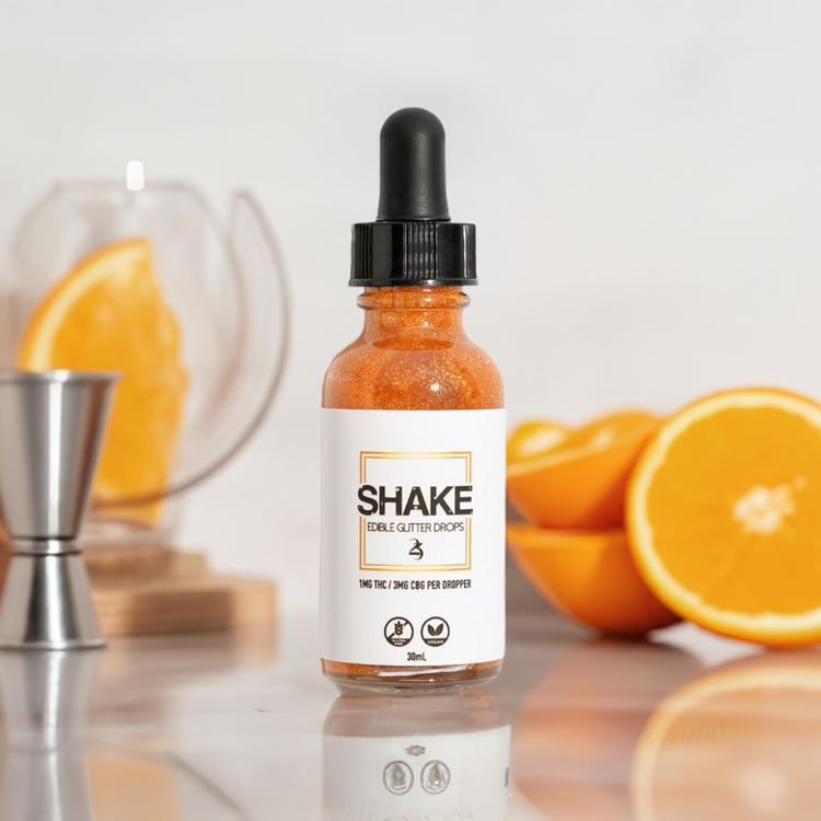 SHAKE with a jigger and orange wedges.