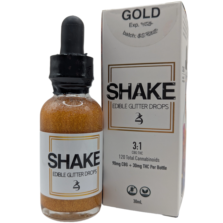Bottle and packaging of 24k Shake Edible THC infused Glitter Drops with 'Gold' label on a white background