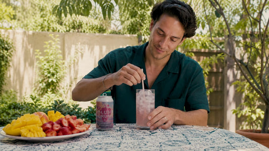 Person setting timer beside hemp beverage can