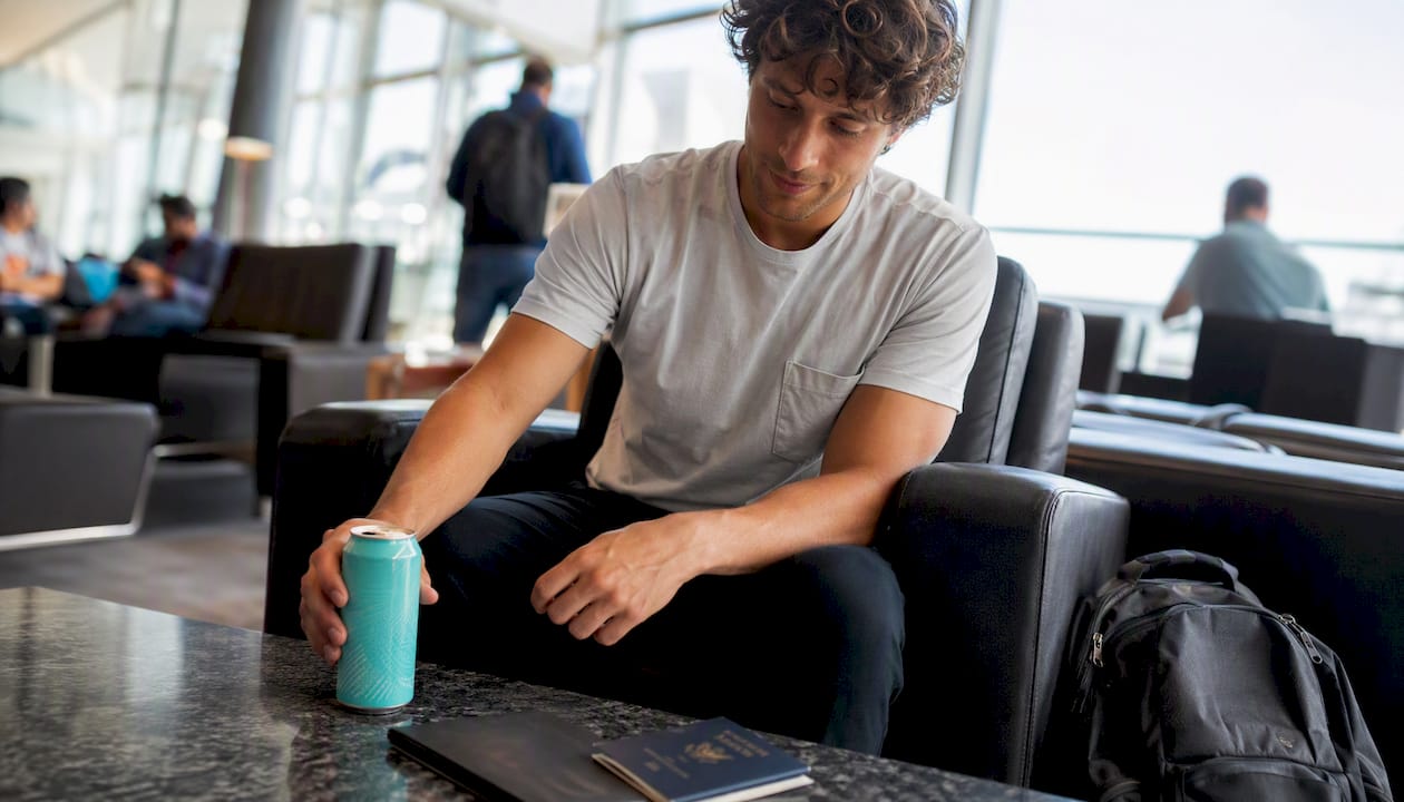 Hemp THC drink on airport cafe table