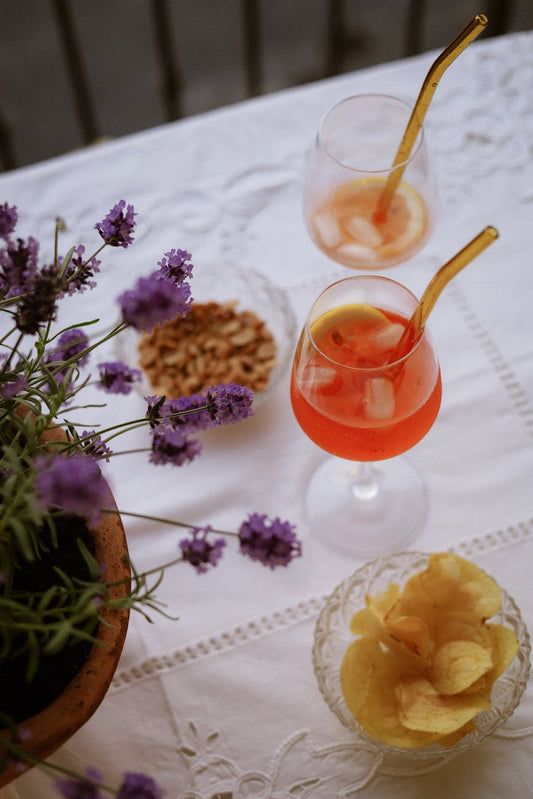 Sparkling drinks with salty snacks on a table for THC drink food pairings