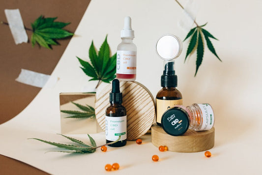 Flat lay of colorful THC gummies next to sparkling cannabis drinks on a pastel background