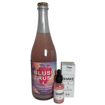 Bottle labeled 'Blush Crush' with a box and dropper labeled 'Shake' on a white background