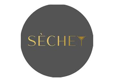 Séchey logo on a dark gray circle