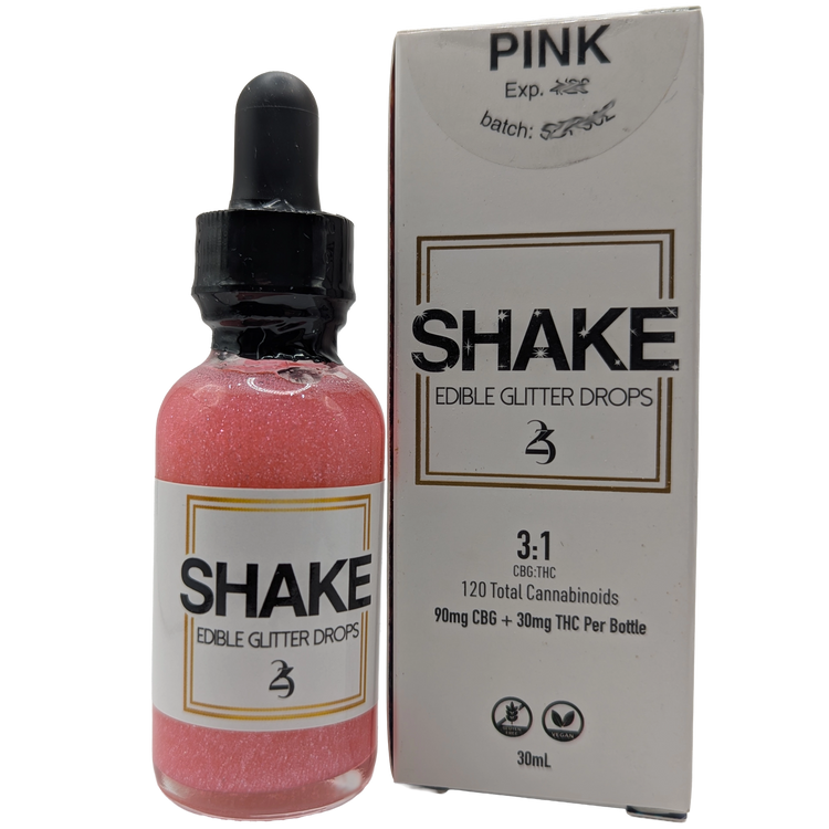 Bottle of pink Cosmo 'SHAKE' edible THC infused glitter drops with packaging on a white background